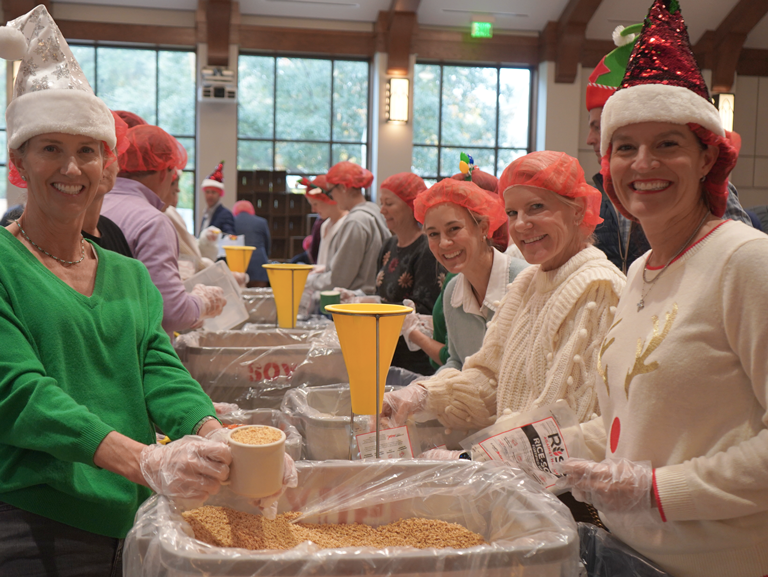 Volunteers packing meals with Rise Against Hunger at Good Shepherd Episcopal Church in Austin Texas