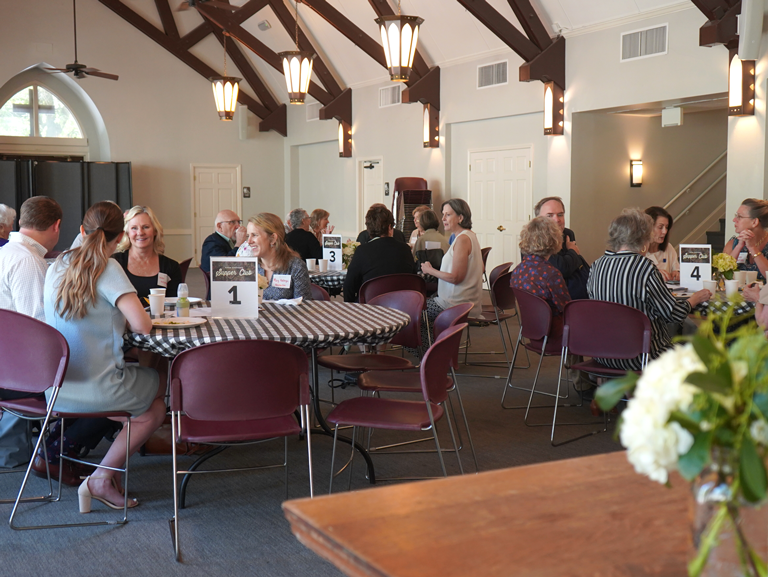 Good Shepherd Episcopal Church Supper Clubs gathering with parishioners seated at tables in Austin Texas Allen hall