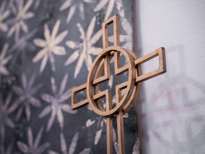 Decorative cross displayed inside Good Shepherd Episcopal Church in Austin, Texas, symbolizing the Christian faith and Episcopal worship.
