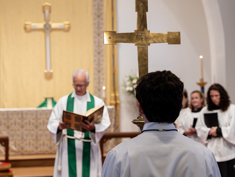 Processional cross stands before the altar during an Episcopal worship service at Good Shepherd Episcopal Church in Austin, Texas.