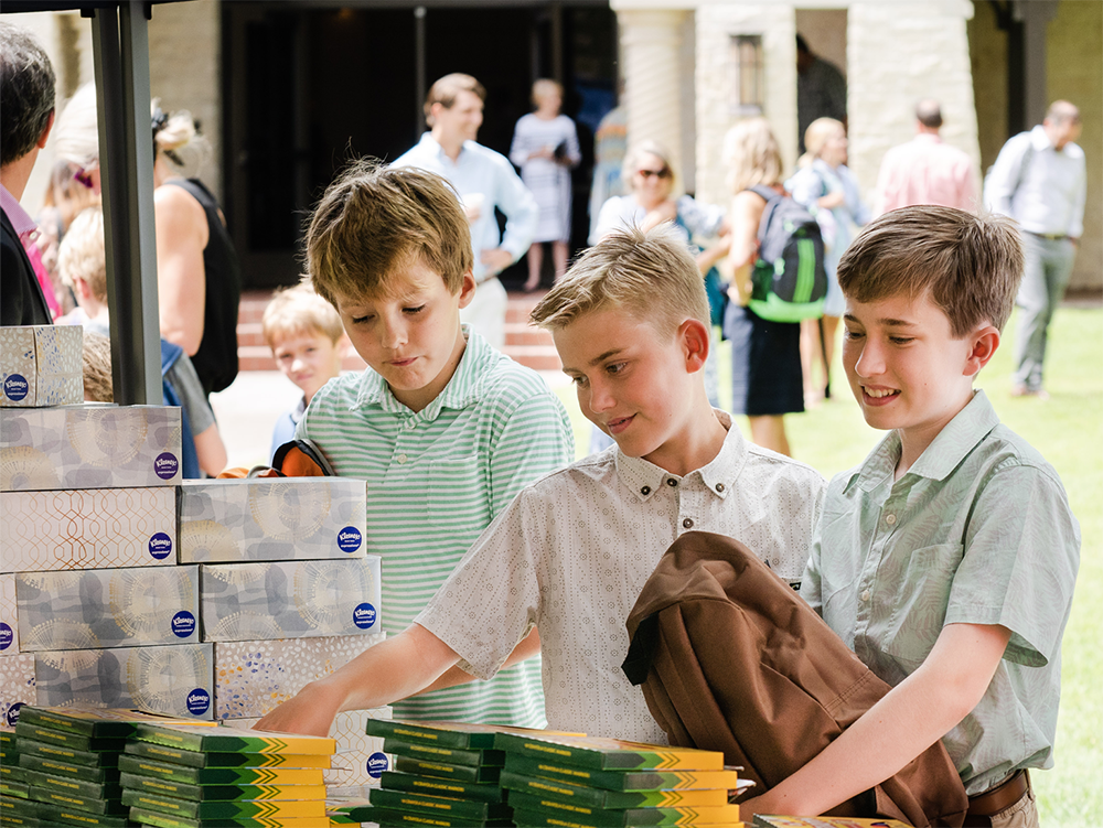 Children and youth pack school supplies for a community outreach project at Good Shepherd Episcopal Church in Austin, Texas.
